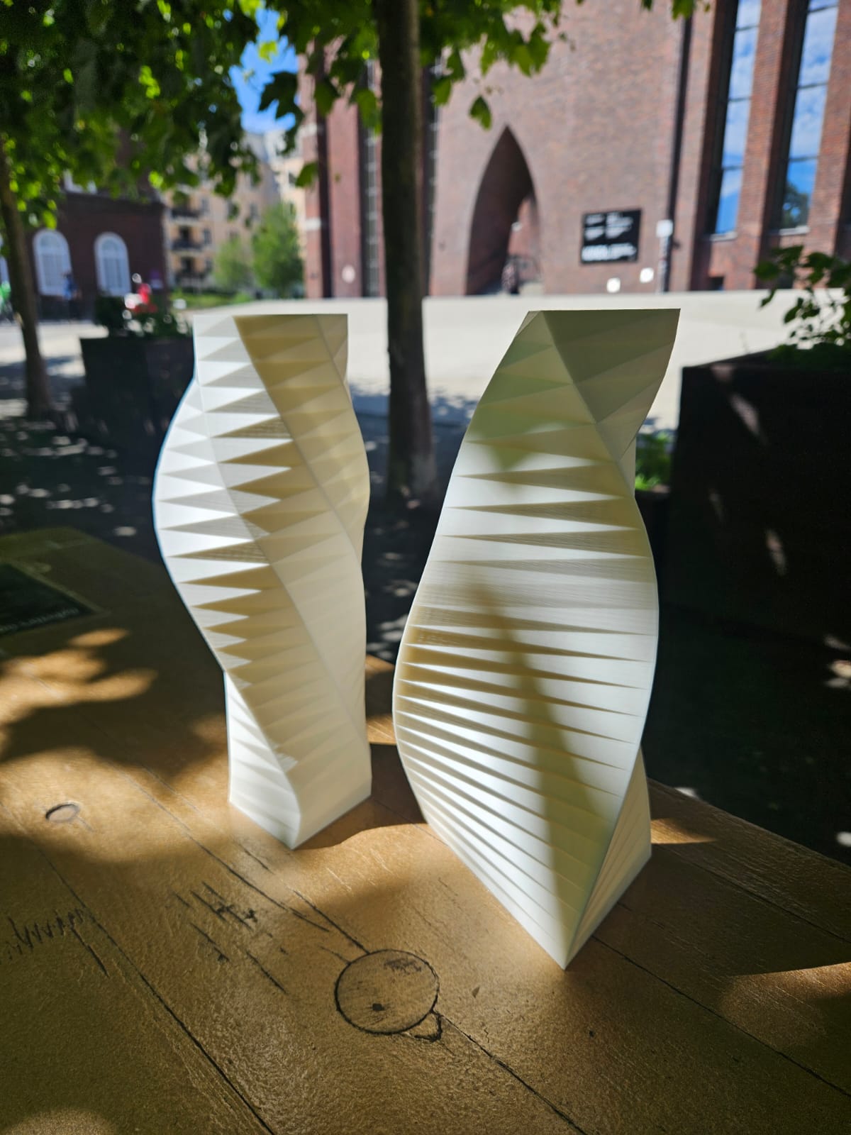 A triangular-base and a hexagonal-base WindVase side by side