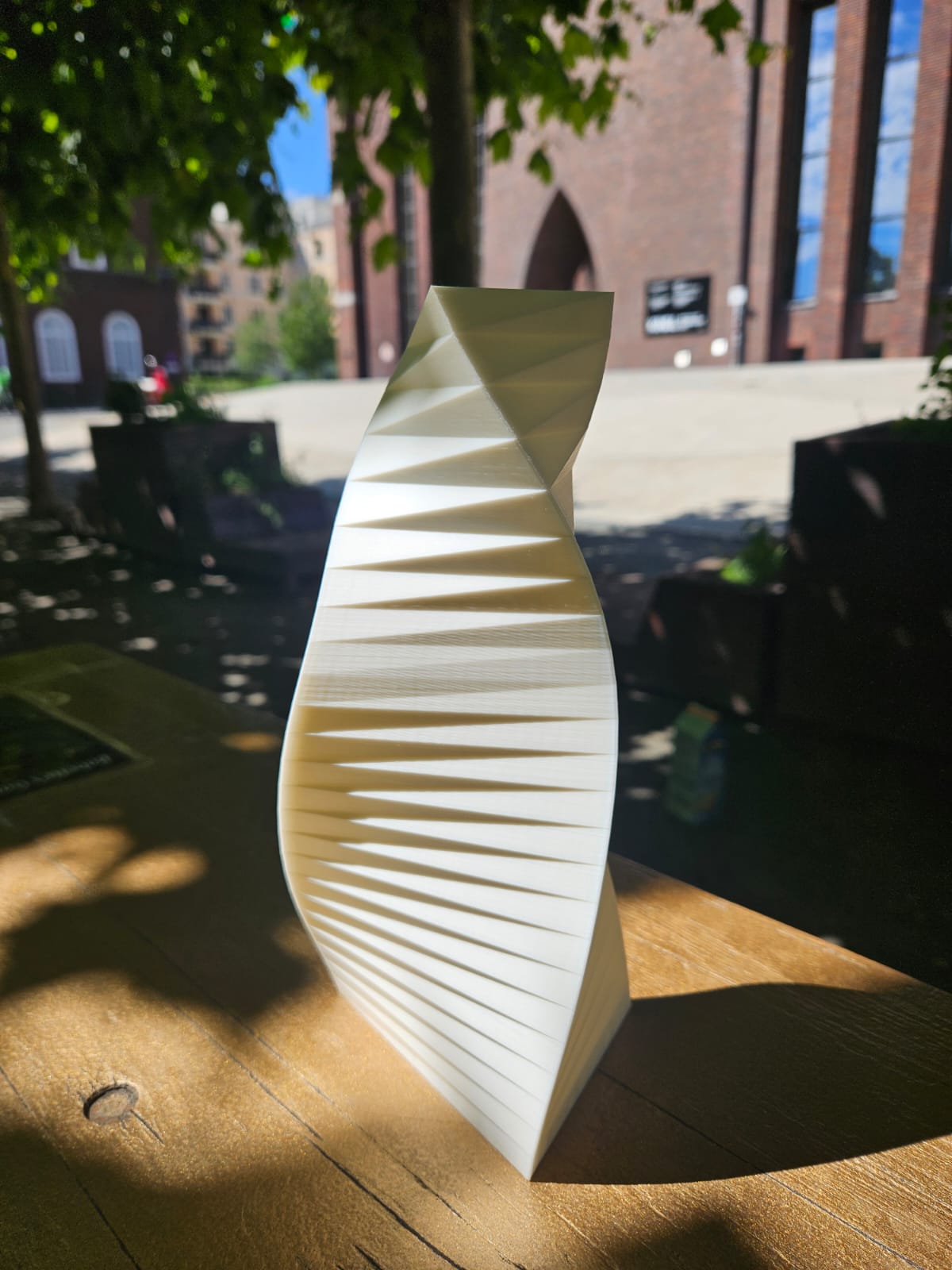WindVase with triangular base and structured surface